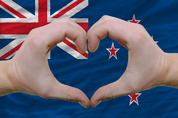 Image showing Heart and love gesture showed by hands over flag of new zealand 