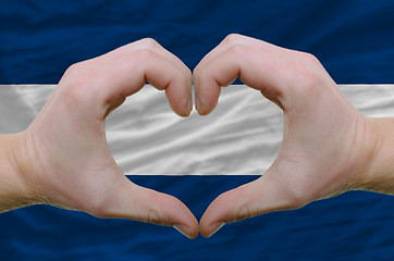 Image showing Heart and love gesture showed by hands over flag of nicaragua ba