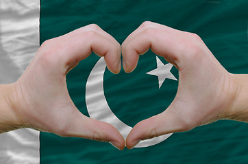 Image showing Heart and love gesture showed by hands over flag of pakistan bac