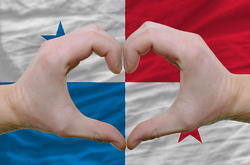 Image showing Heart and love gesture showed by hands over flag of panama backg