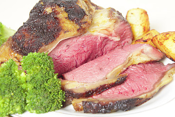 Image showing Roast sirloin beef joint on plate