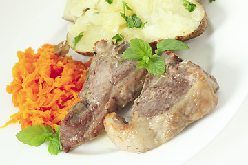 Image showing Lamb chops carrots and baked potato