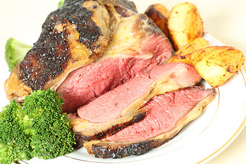 Image showing Roast sirloin beef joint angled