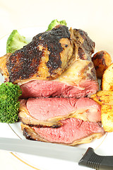 Image showing Roast sirloin beef joint vertical