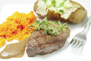 Image showing Filet mignon meal with fork