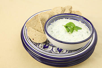 Image showing Tzatziki dip and plates