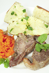 Image showing Lamb chops carrots and baked potato vertical