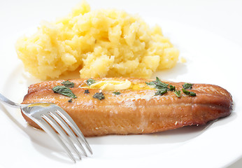 Image showing Grilled kipper and mashed potato and fork