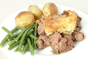 Image showing Steak and kidney pie on plate