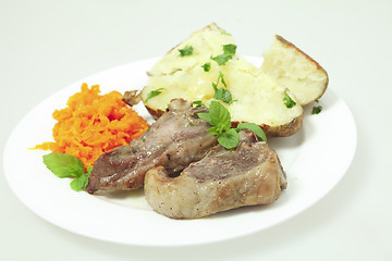 Image showing Lamb chops carrots and baked potato plate