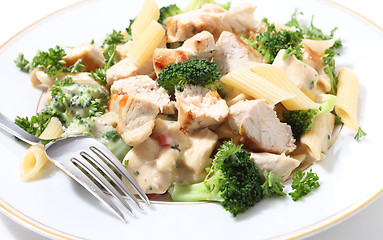 Image showing Grilled chicken with pasta and fork