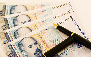 Image showing Money with a pen