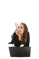 Image showing Girl with laptop on floor thinking about something