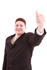 Image showing young business man going thumb up, isolated on white 