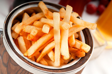 Image showing fresh french fries on a bucket