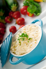 Image showing mac and cheese on a blue little clay pot