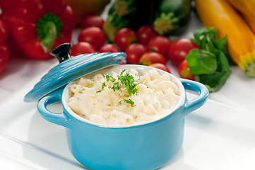 Image showing mac and cheese on a blue little clay pot