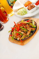 Image showing original fajita sizzling hot  on iron plate