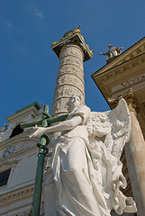 Image showing Statue of an Angel with cross and snake