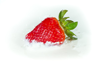 Image showing strawberry splashing into milk