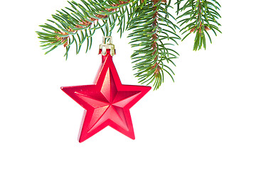 Image showing red christmas star hanging from tree