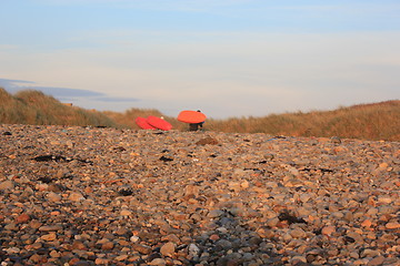 Image showing kayakers leaving the beach