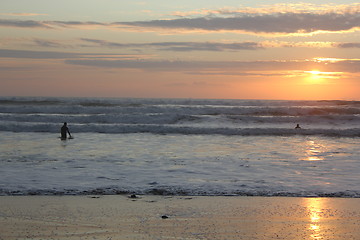 Image showing surfing at sunset