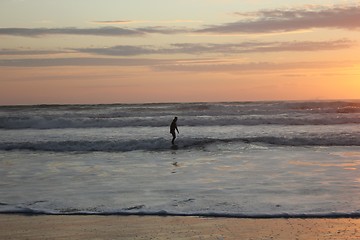 Image showing surfing at sunset