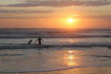 Image showing surfing at sunset