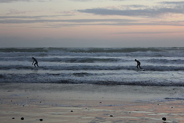 Image showing surfing at sunset