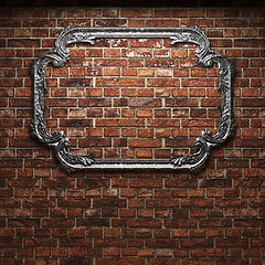 Image showing illuminated brick wall and frame