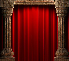 Image showing red velvet curtains behind the old wood columns