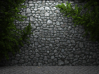 Image showing illuminated stone wall and ivy