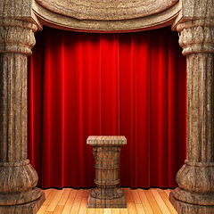 Image showing red velvet curtains, wood columns and Pedestal