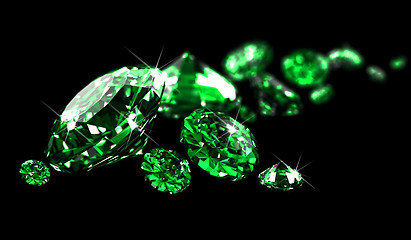 Image showing Emeralds on black surface