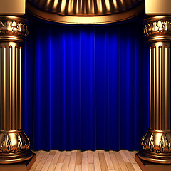 Image showing blue velvet curtains behind the gold columns