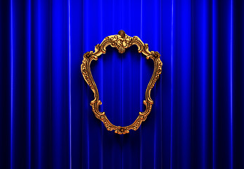 Image showing blue curtains, gold frame