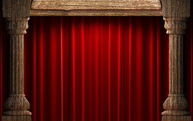 Image showing red velvet curtains behind the old wood columns