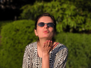 Image showing Girl blowing a kiss