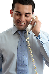 Image showing Businessman communicating by telephone