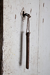 Image showing Old key in old door