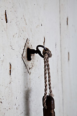 Image showing Old key in old door