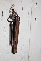 Image showing Old key in old door