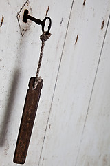 Image showing Old key in old door