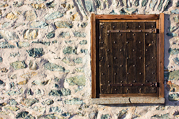 Image showing Wood window on stone