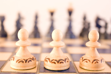 Image showing Ready for the battle - three pawns