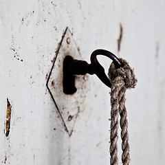 Image showing Old key in old door