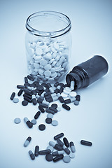 Image showing pills in glass container
