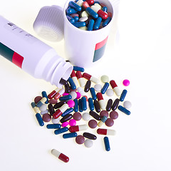 Image showing pills spilling out of container 