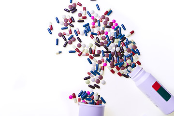 Image showing pills spilling out of container 